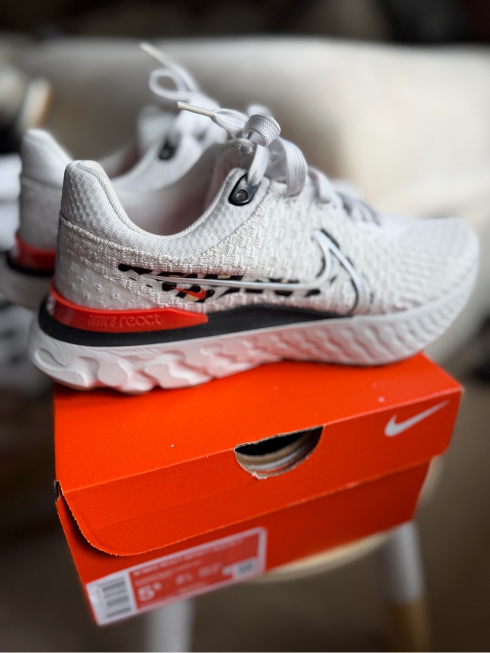Nike Women’s White Sneakers with Orange Accent